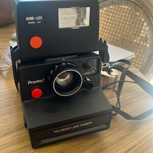 Polaroid pronto land camera with flash attachment, and case